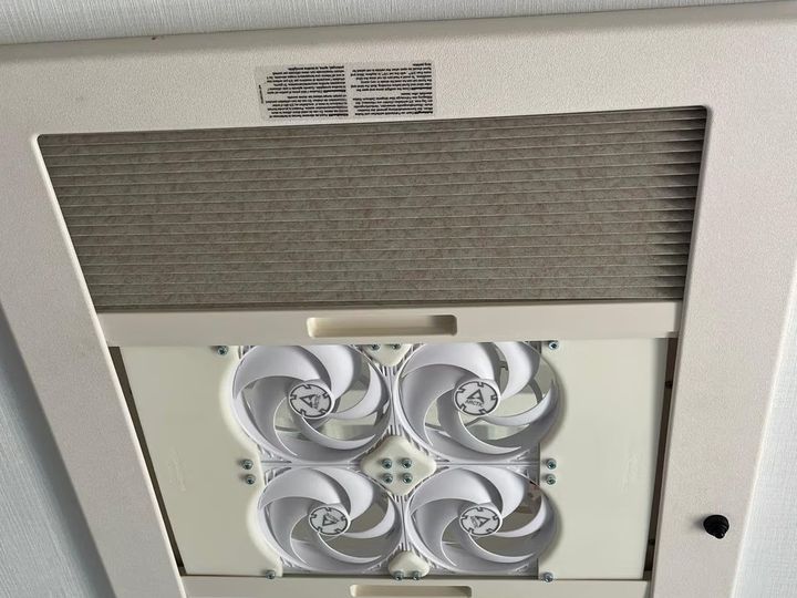 3D printed mount with PC fans in a Dometic motorhome roof window